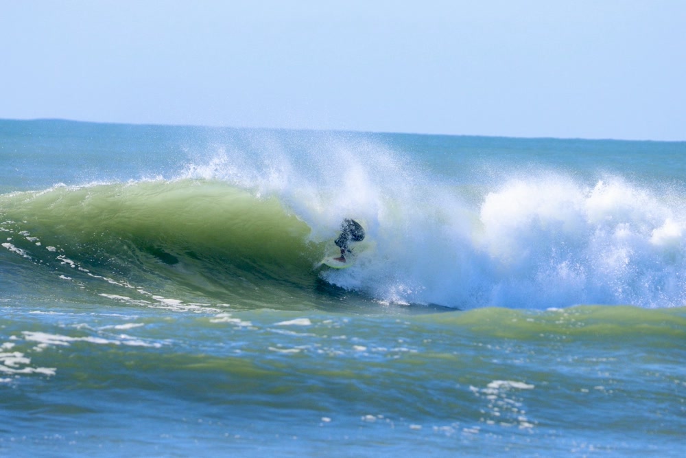 Barrel sequence, frame 3: deep in the barrel as the lip throws over