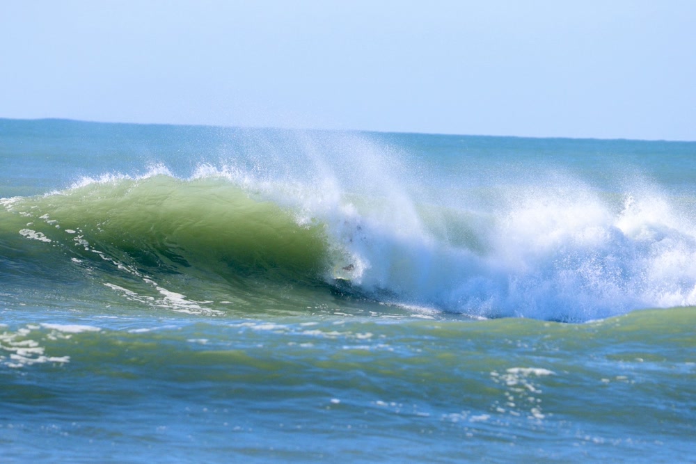 Barrel sequence, frame 5: spray blowing out as the barrel closes