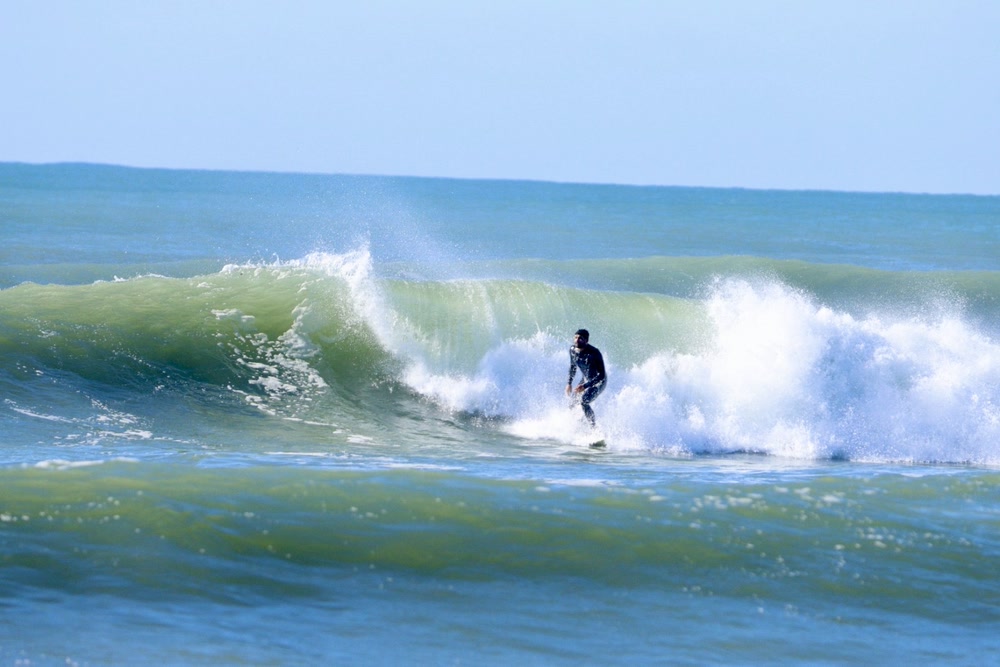 Barrel sequence, frame 6: the surfer coming out onto the open shoulder