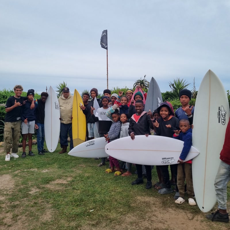 A group of young surfers in Jeffreys Bay with their Paul Jeggels Designs boards